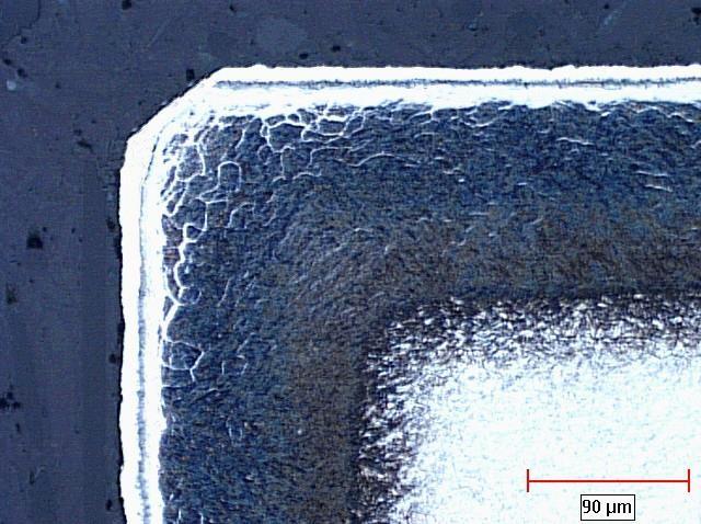 Micrograph showing a typical corner effect on a die bearing surface